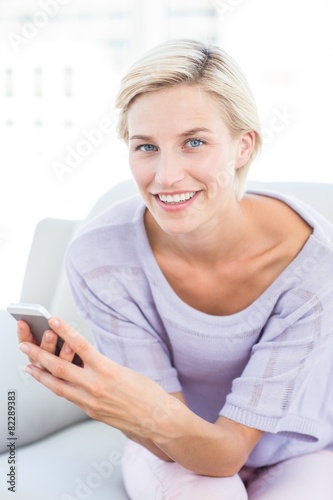Pretty blonde woman texting with her mobile phone Free Download Pretty blonde woman texting with her mobile phone - GFXLoad