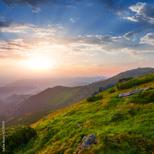 green mount slope at the sunset