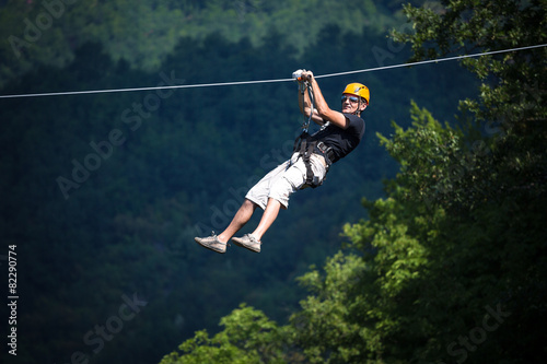 Adult man on zip line adventure