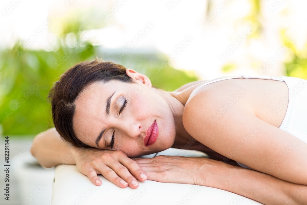 Obraz premium Calm woman lying on massage table