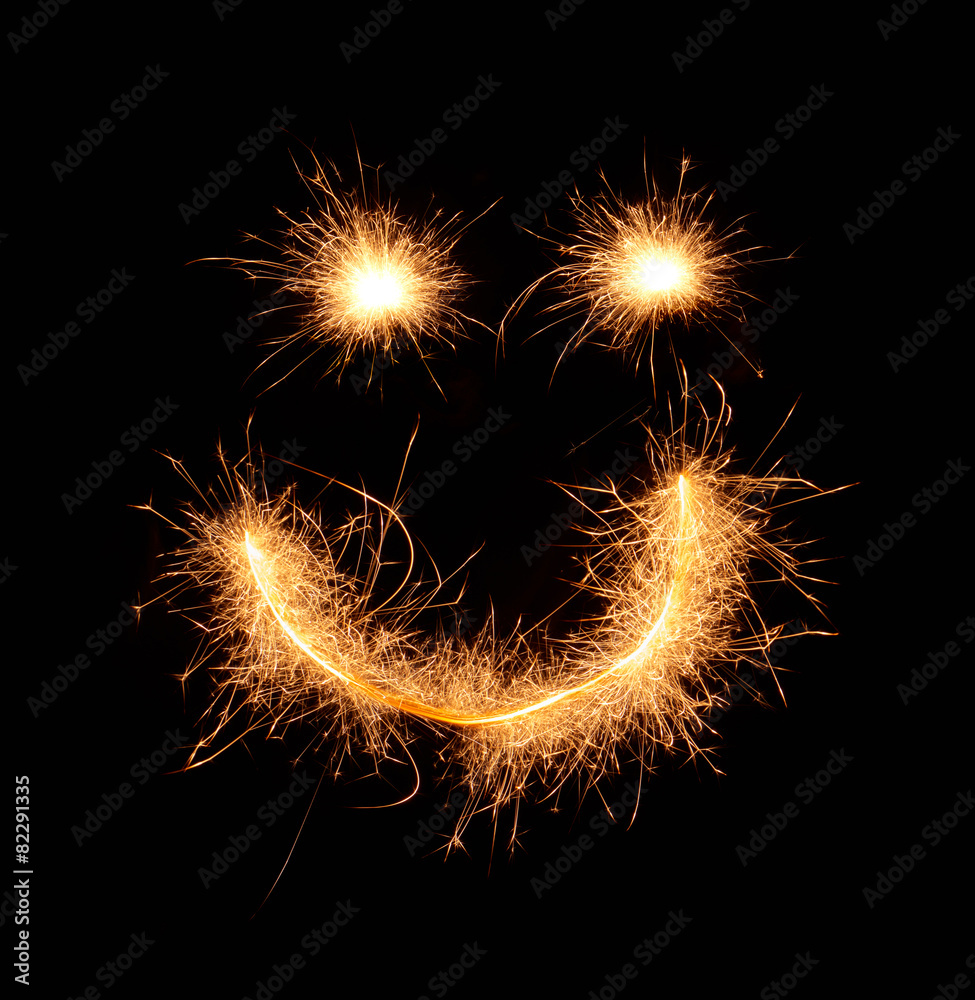 Happy weird smiling smiley drawn with sparkles isolated on black Happy weird smiling smiley drawn with sparkles isolated on black