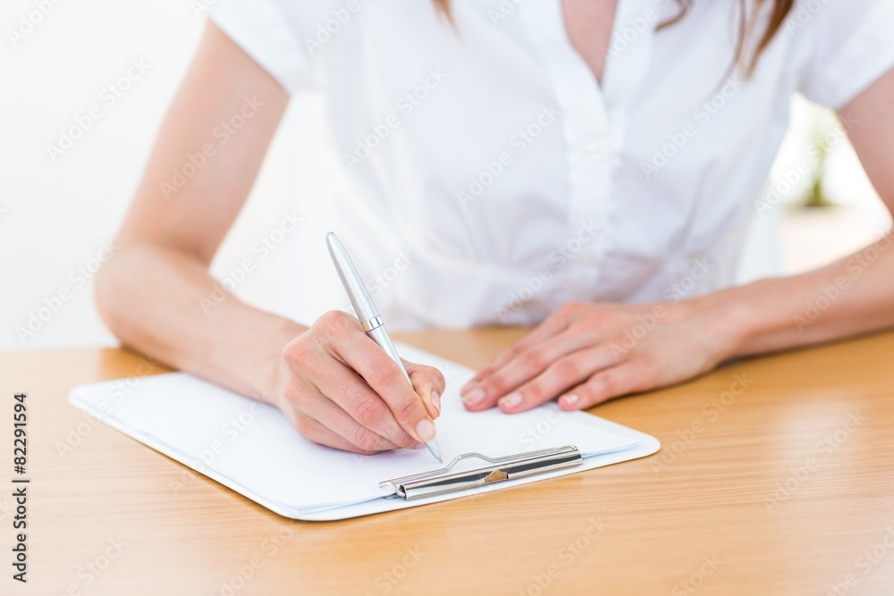 Businesswoman taking notes