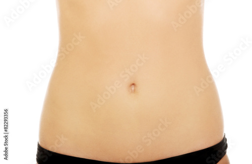 Fit young woman belly.