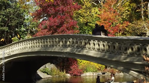 WS TU Couple stopping in middle of bridge over lake in Central Park, New York City, New York State, USA