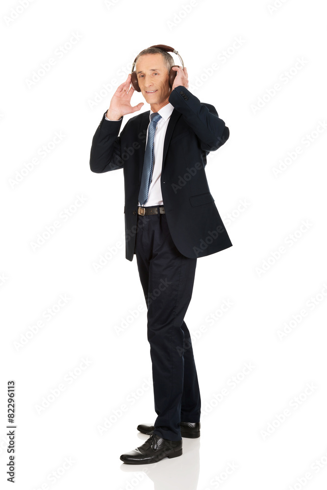 Businessman with big headphones Businessman with big headphones