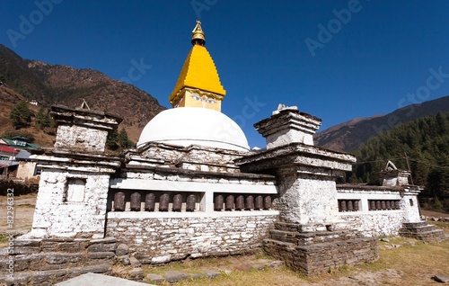 Stupa and prayer wheels in Junbesi village photo