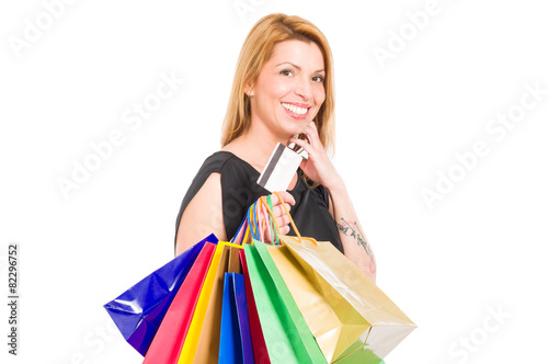 Shopping woman holding shopping bags and credit or debit card