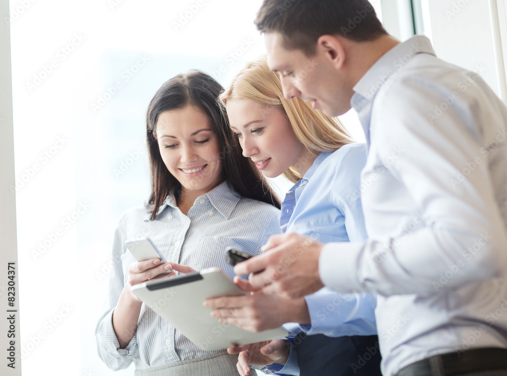 business team working with tablet pcs in office business team working with tablet pcs in office