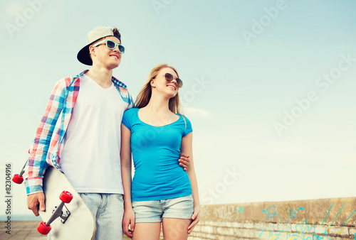 smiling couple having fun outdoors © Syda Productions