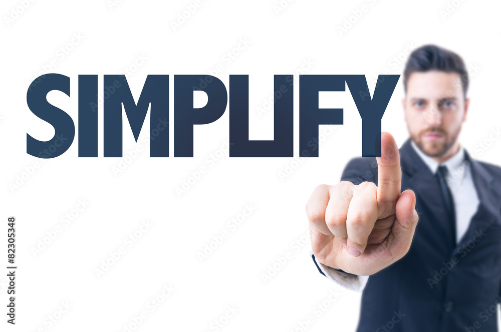 Business man pointing the text: Simplify Business man pointing the text: Simplify