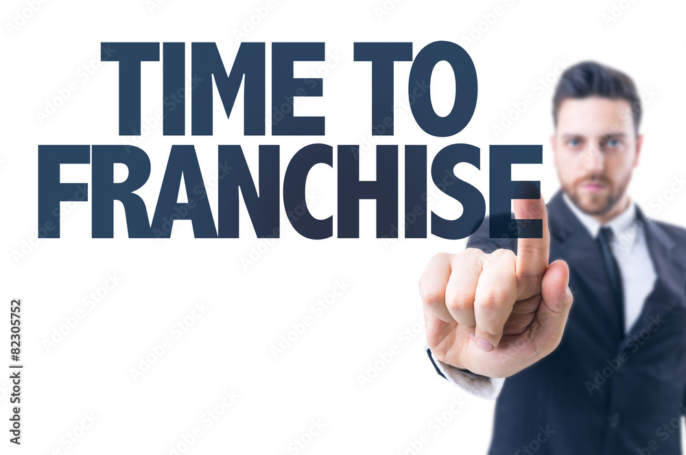Business man pointing the text: Time to Franchise Business man pointing the text: Time to Franchise