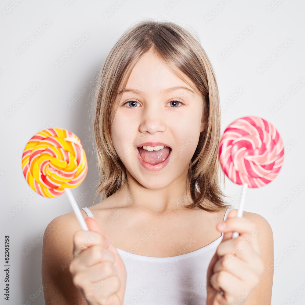 Cute girl with lollipop - difficult choice