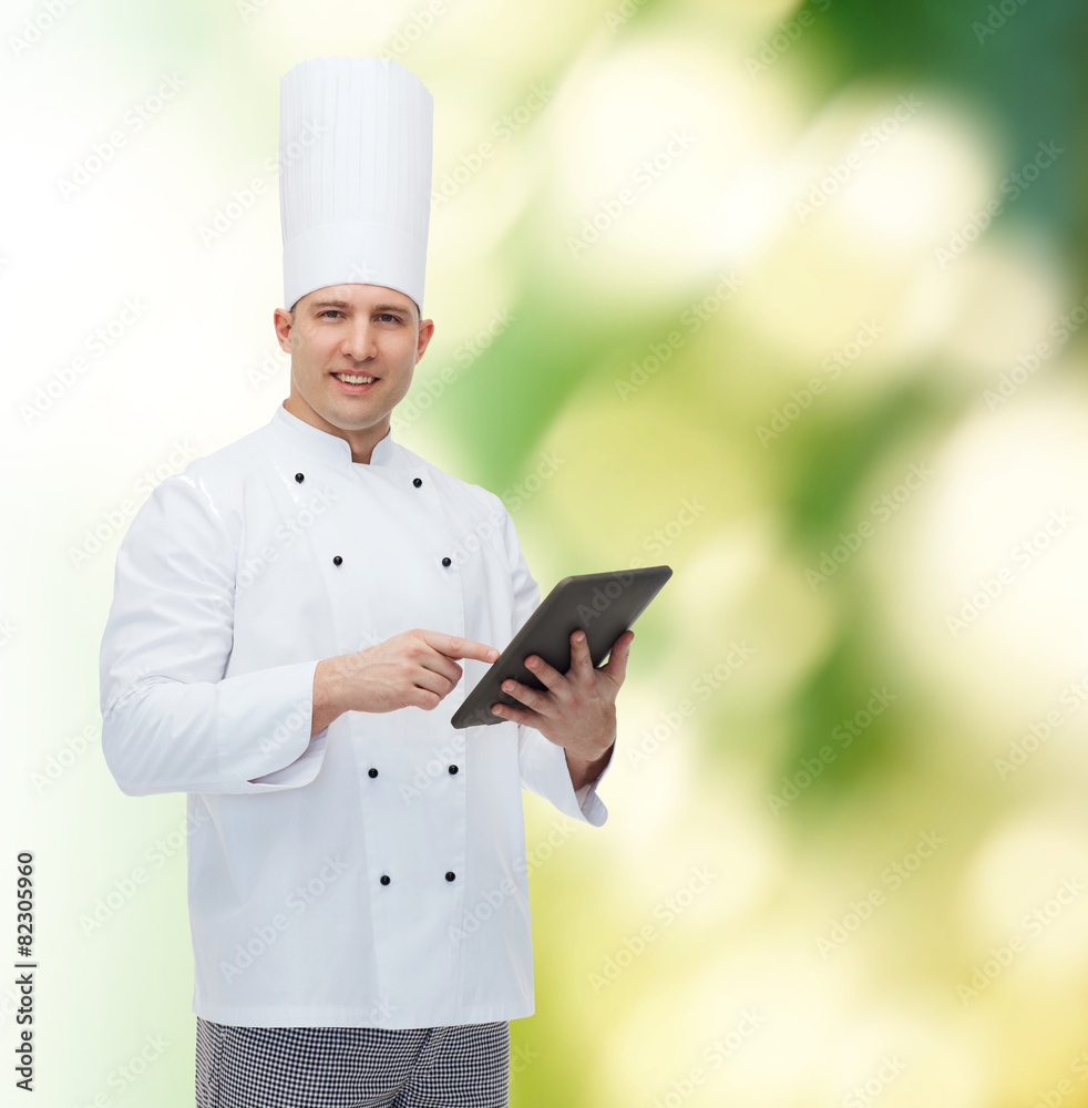 happy male chef cook holding tablet pc happy male chef cook holding tablet pc