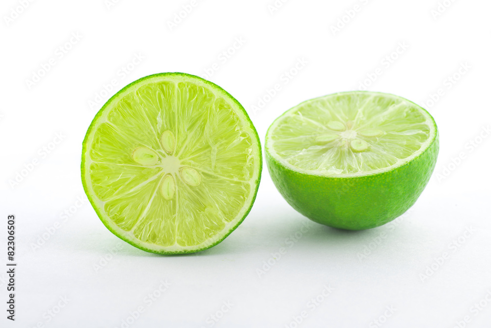 Half of Fresh lime citrus fruit on white background