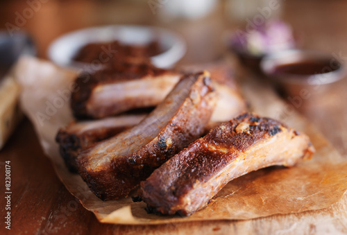 pork bbq grilled spare rib portions in natural lighting