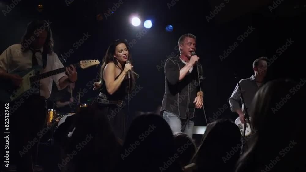 Singers and musicians performing on stage as audience dances / Spanish Fork, Utah, United States, 