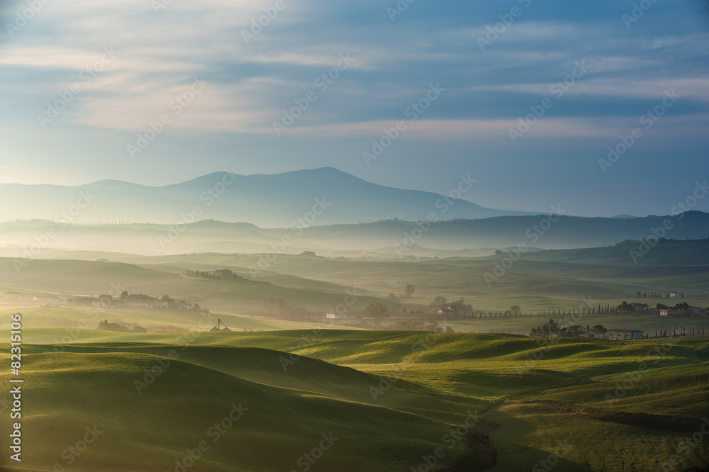 Fields and forests painted Tuscan sunset light