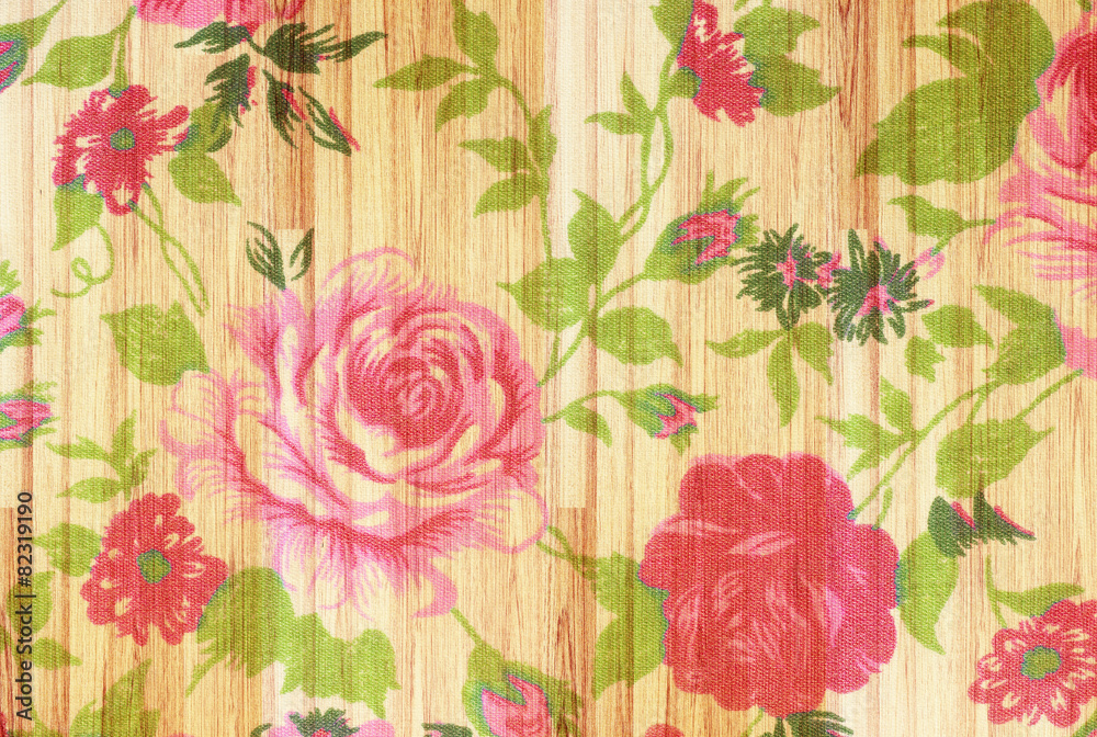 rose vintage from fabric on  wooden background.