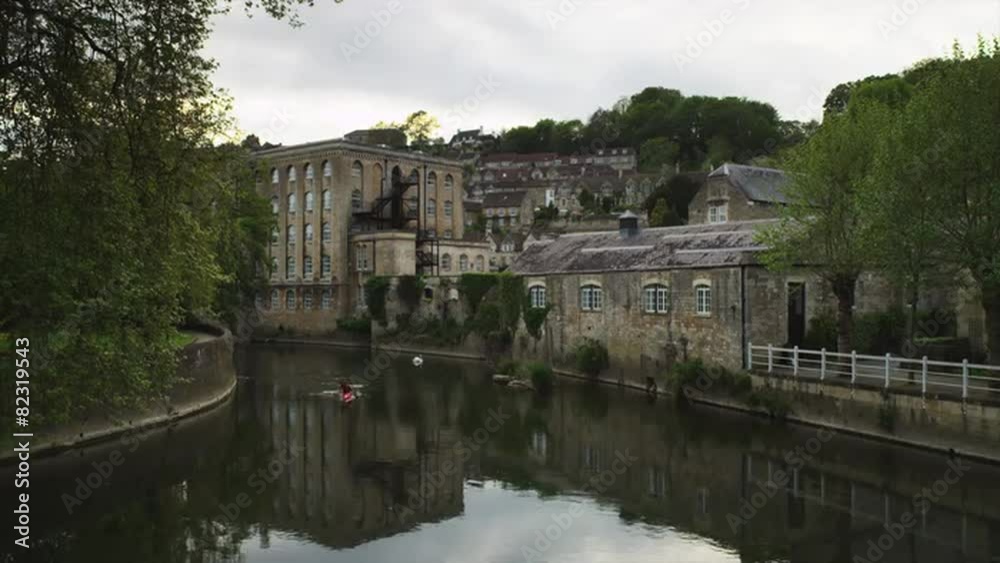 WS Townscape with person kayaking on river / Bradford on Avon, Wiltshire, UK WS Townscape with person kayaking on river / Bradford on Avon, Wiltshire, UK