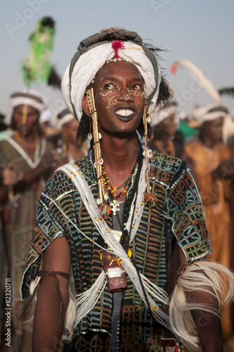 Wodaabe man dancing Yaake during Gerewol, Cure Salee, Niger photo