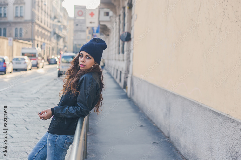 Fototapeta premium Beautiful girl posing in an urban context