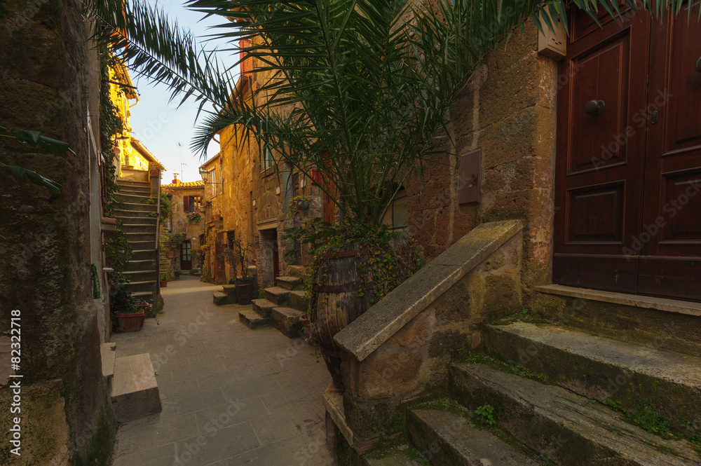 Italian old ancient alley in the medieval Tuscan town Italian old ancient alley in the medieval Tuscan town