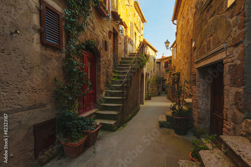 Fototapeta Naklejka Na Ścianę i Meble -  Italian old ancient alley in the medieval Tuscan town
