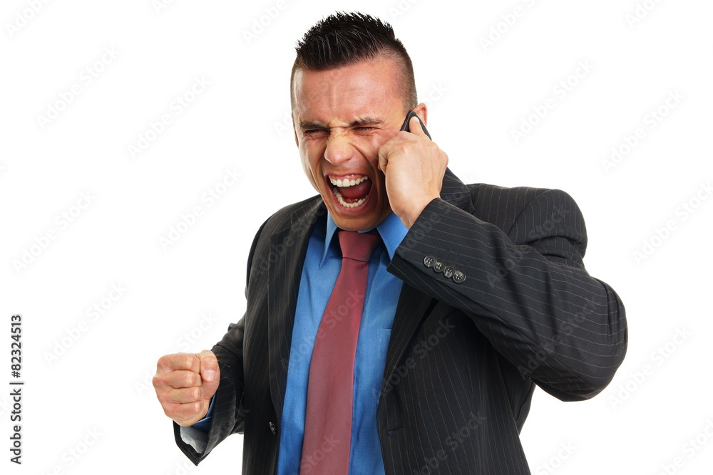 Angry crazy young man in suit yells into mobile phone Angry crazy young man in suit yells into mobile phone