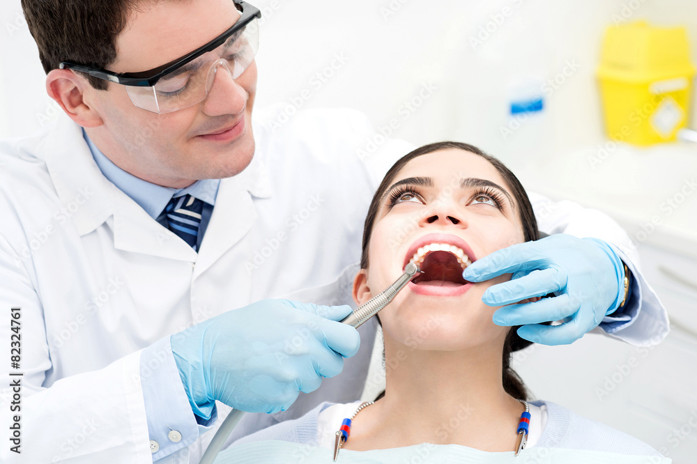 Naklejka premium Teeth whitening at dental office