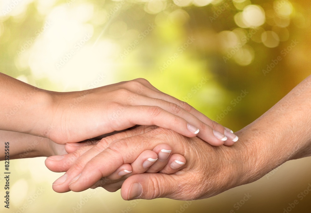 Human Hand. Adult helping senior in hospital Human Hand. Adult helping senior in hospital