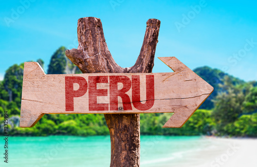 Peru wooden sign with beach background photo