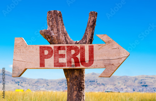 Peru wooden sign with Titicaca Lake background photo