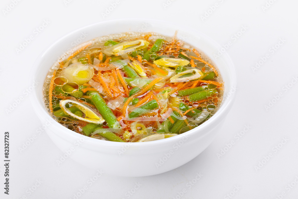 Fresh vegetable soup made of green bean, carrot, potato and leek Fresh vegetable soup made of green bean, carrot, potato and leek