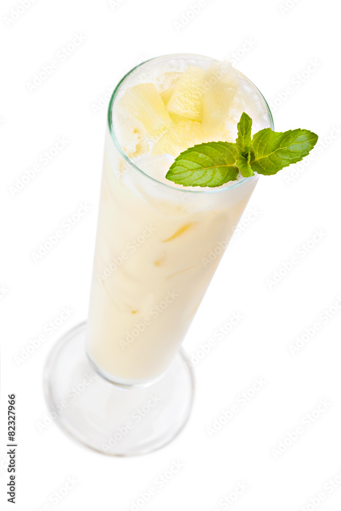Cocktail Pina Colada in a tall glass garnished mint leaf. Isola Cocktail Pina Colada in a tall glass garnished mint leaf. Isola