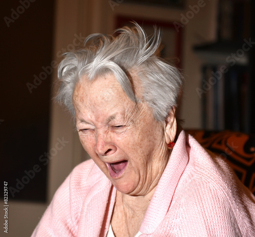 Old woman yawning