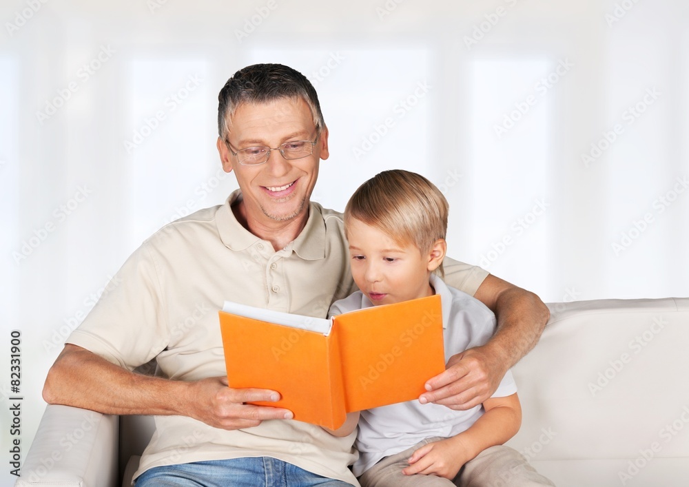Grandchild. Grandmother and little boy reading book happy Grandchild. Grandmother and little boy reading book happy