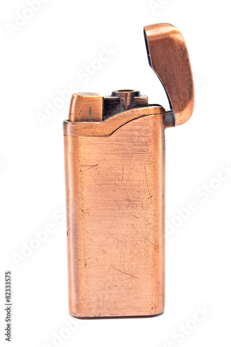 Golden vintage lighter isolated on white