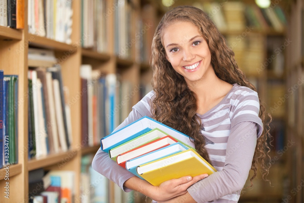 Student. Pretty Female Student Surrounded by Library Books Student. Pretty Female Student Surrounded by Library Books