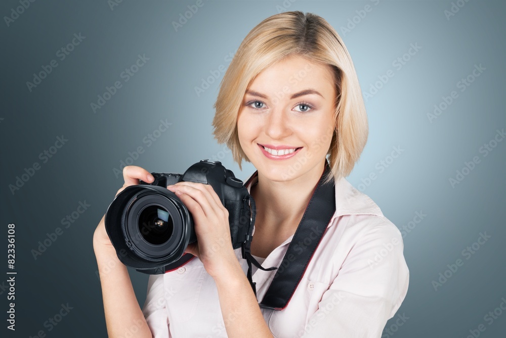 Photographer. Happy female photographer with a camera - isolated Photographer. Happy female photographer with a camera - isolated