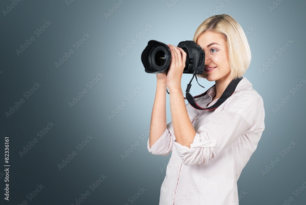 Camera. Girl taking a picture using digital camera Camera. Girl taking a picture using digital camera