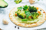 vegan tortilla with roasted broccoli and chickpeas and avocado s