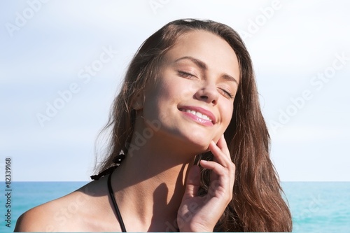Face. Suntan Lotion Woman Applying Sunscreen Solar Cream