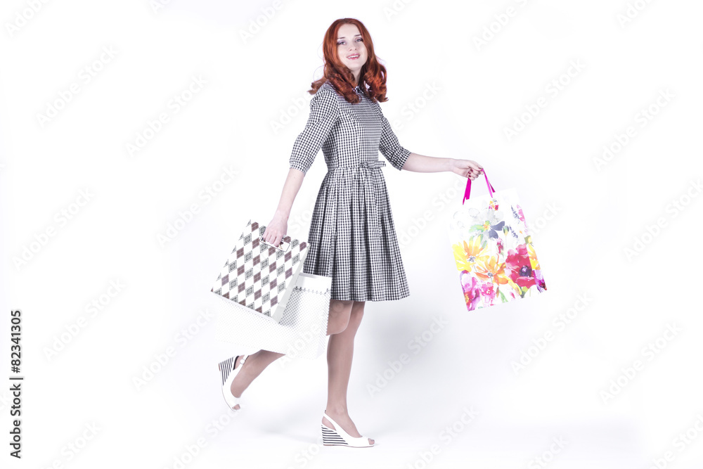 Woman walking with bags from the store