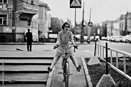 cheerful girl on a bicycle movement