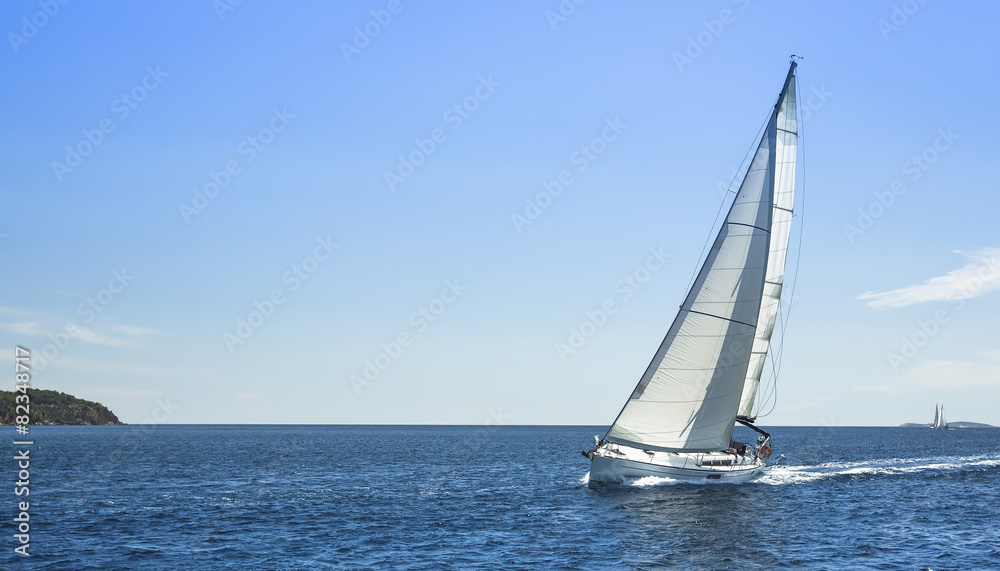 Boat competitor of sailing regatta in clear weather. Yachting.