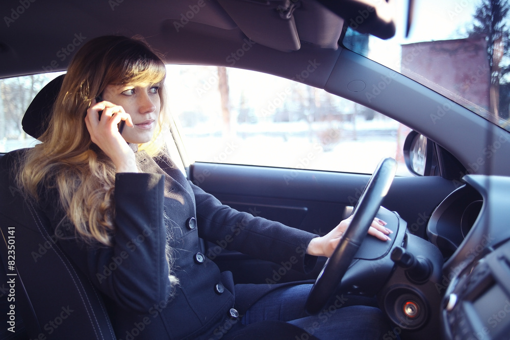 portrait of a girl in a car driver at the wheel