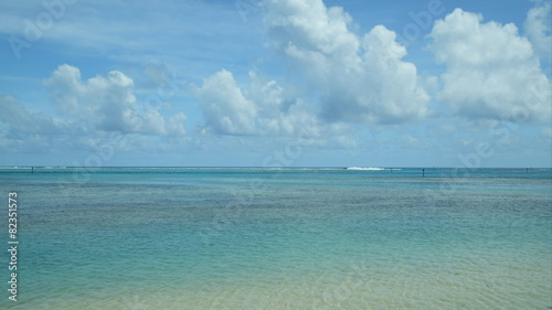 time lapse movie of clouds moving past a beautiful tropical beach photo