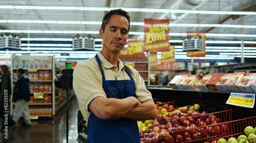 grocer looking at camera