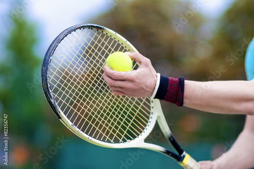 Closeup of Hands of Professional Male tennis Player Holding Raqu © danmorgan12