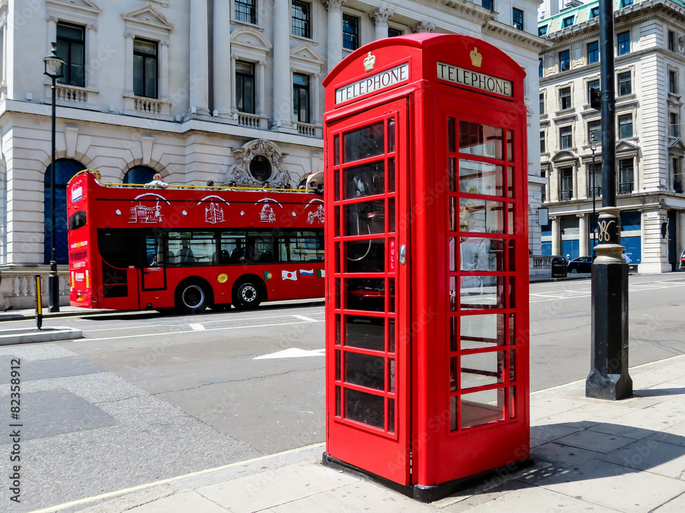 Red phone booth and the red bus on the street of London Red phone booth and the red bus on the street of London